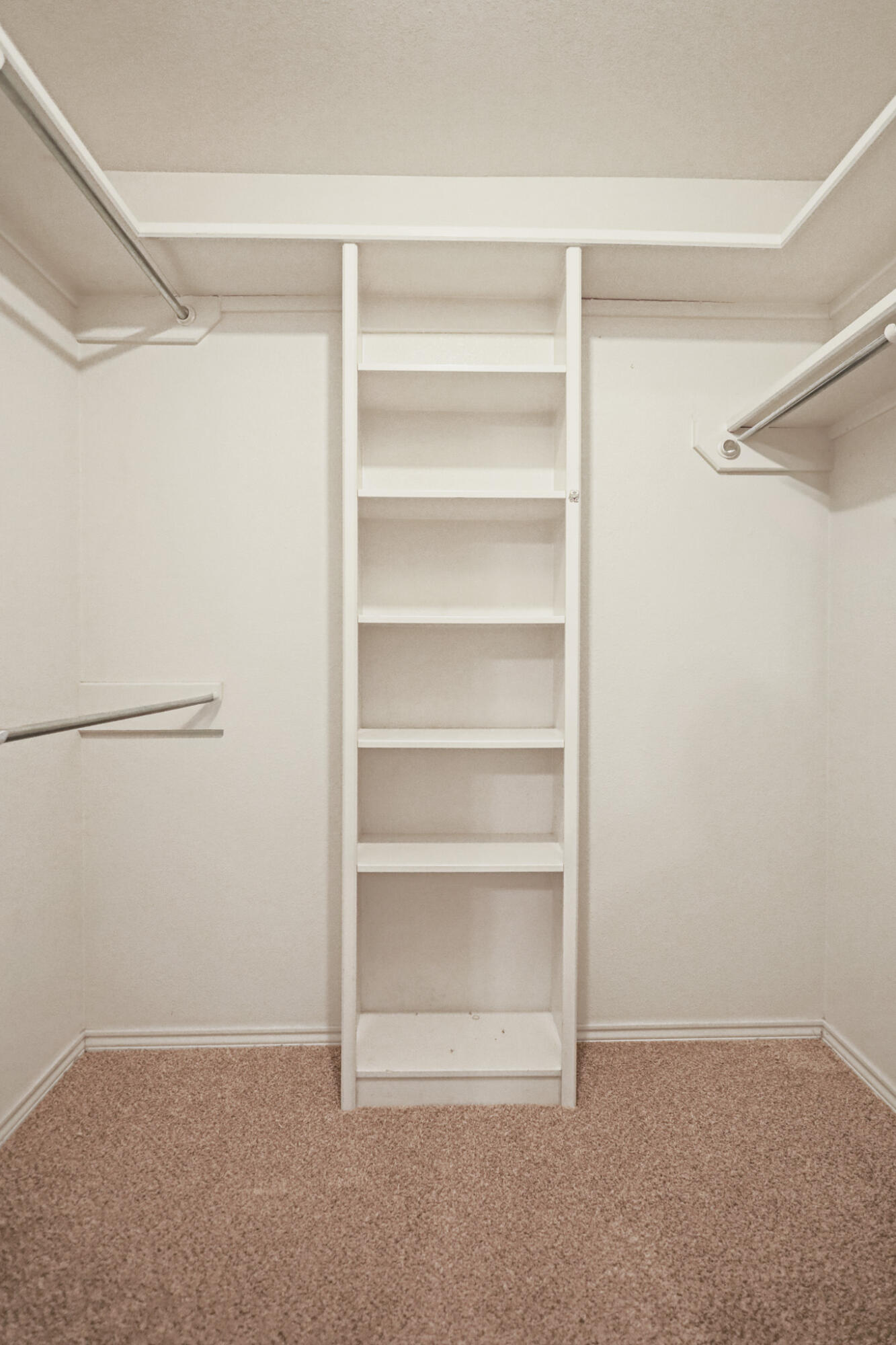 2214 94th Street Lubbock, TX 79423 - Photo 27 of 41 a view of an empty walk in closet