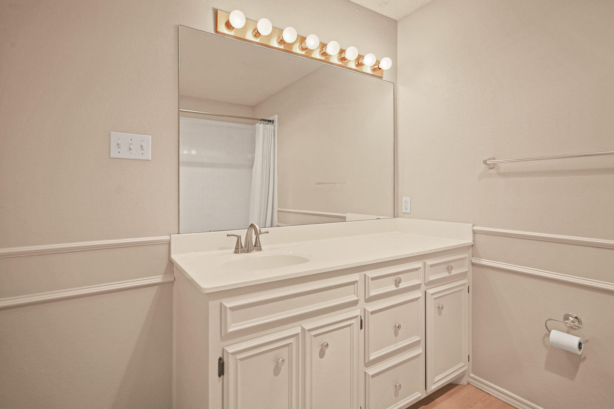 2214 94th Street Lubbock, TX 79423 - Photo 29 of 41 a bathroom with a sink and a mirror