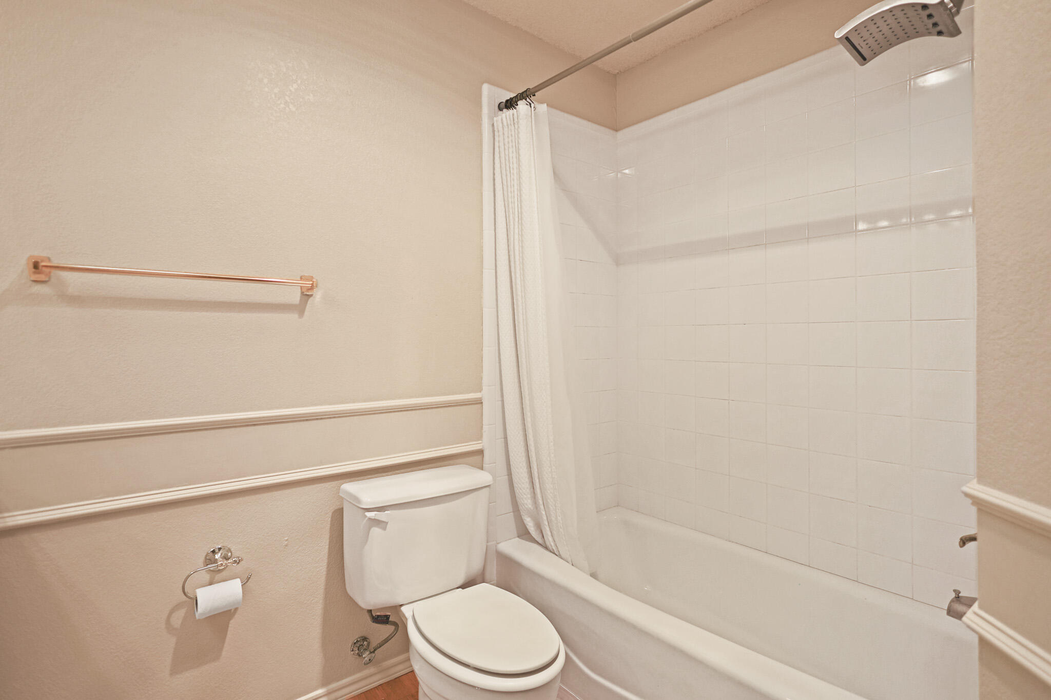 2214 94th Street Lubbock, TX 79423 - Photo 31 of 41 a bathroom with a shower a toilet and a sink