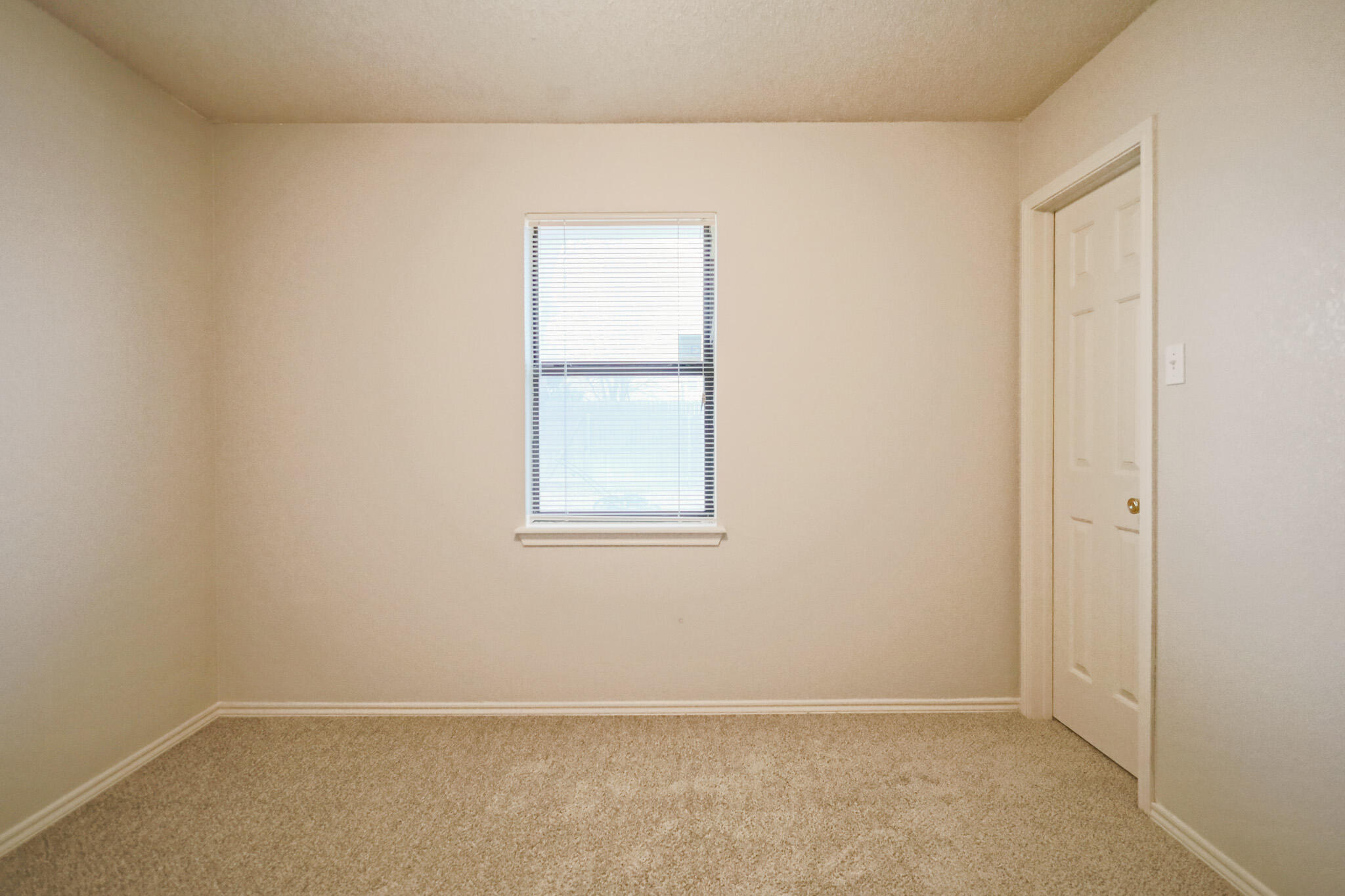 2214 94th Street Lubbock, TX 79423 - Photo 33 of 41 an empty room with a window