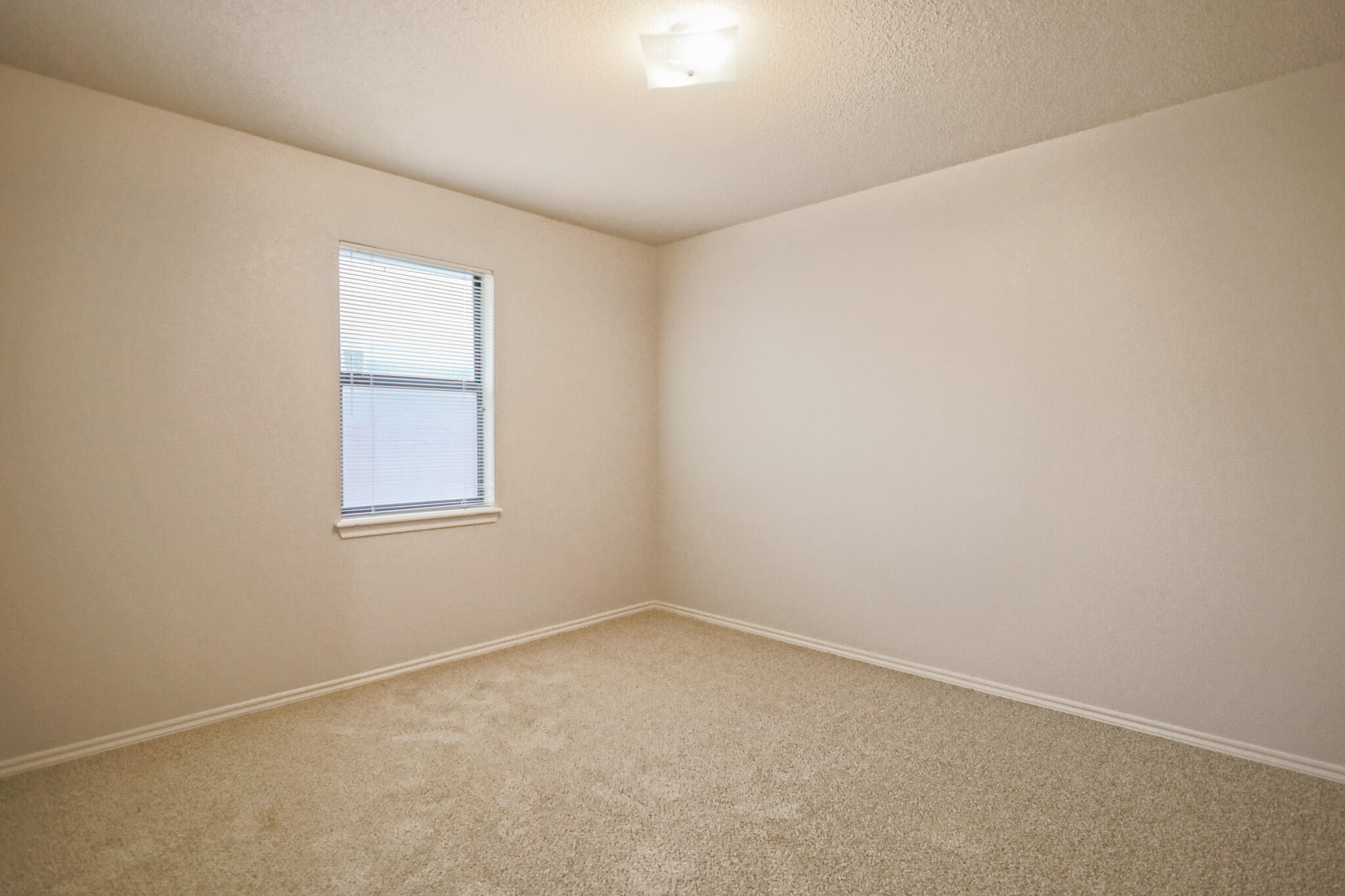 2214 94th Street Lubbock, TX 79423 - Photo 34 of 41 an empty room with a window
