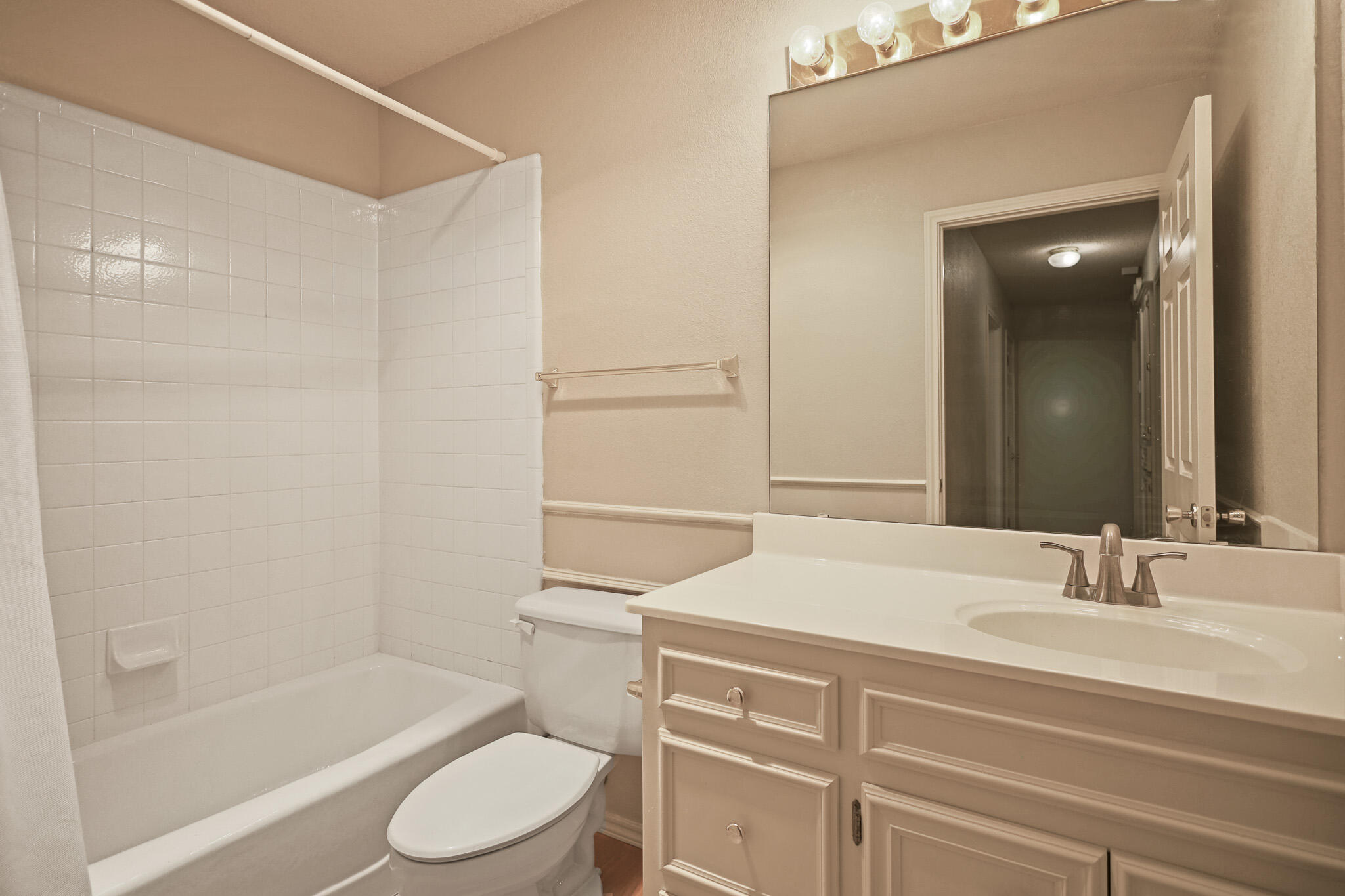 2214 94th Street Lubbock, TX 79423 - Photo 35 of 41 a bathroom with a sink toilet vanity and shower