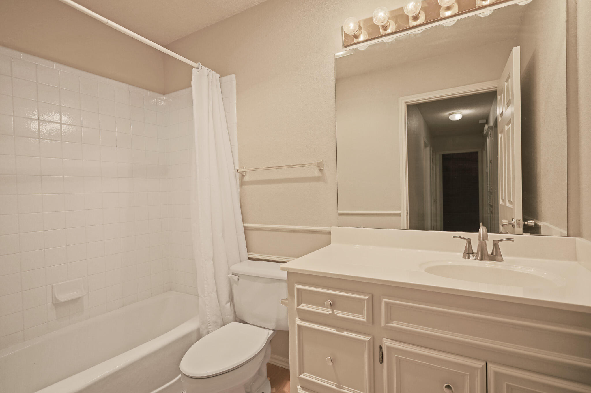 2214 94th Street Lubbock, TX 79423 - Photo 37 of 41 a bathroom with a sink a toilet and shower