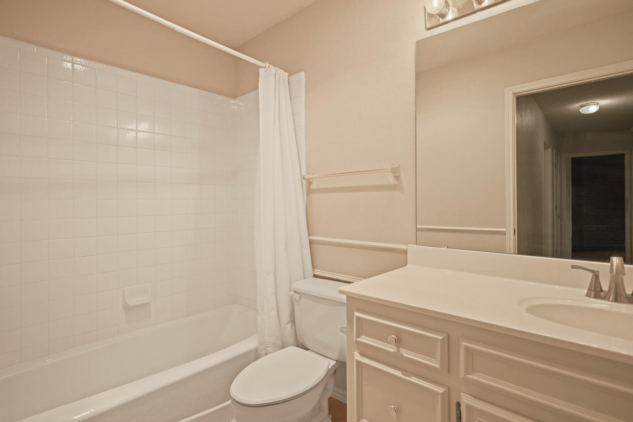 2214 94th Street Lubbock, TX 79423 - Photo 38 of 41 a bathroom with a bathtub shower sink vanity and toilet