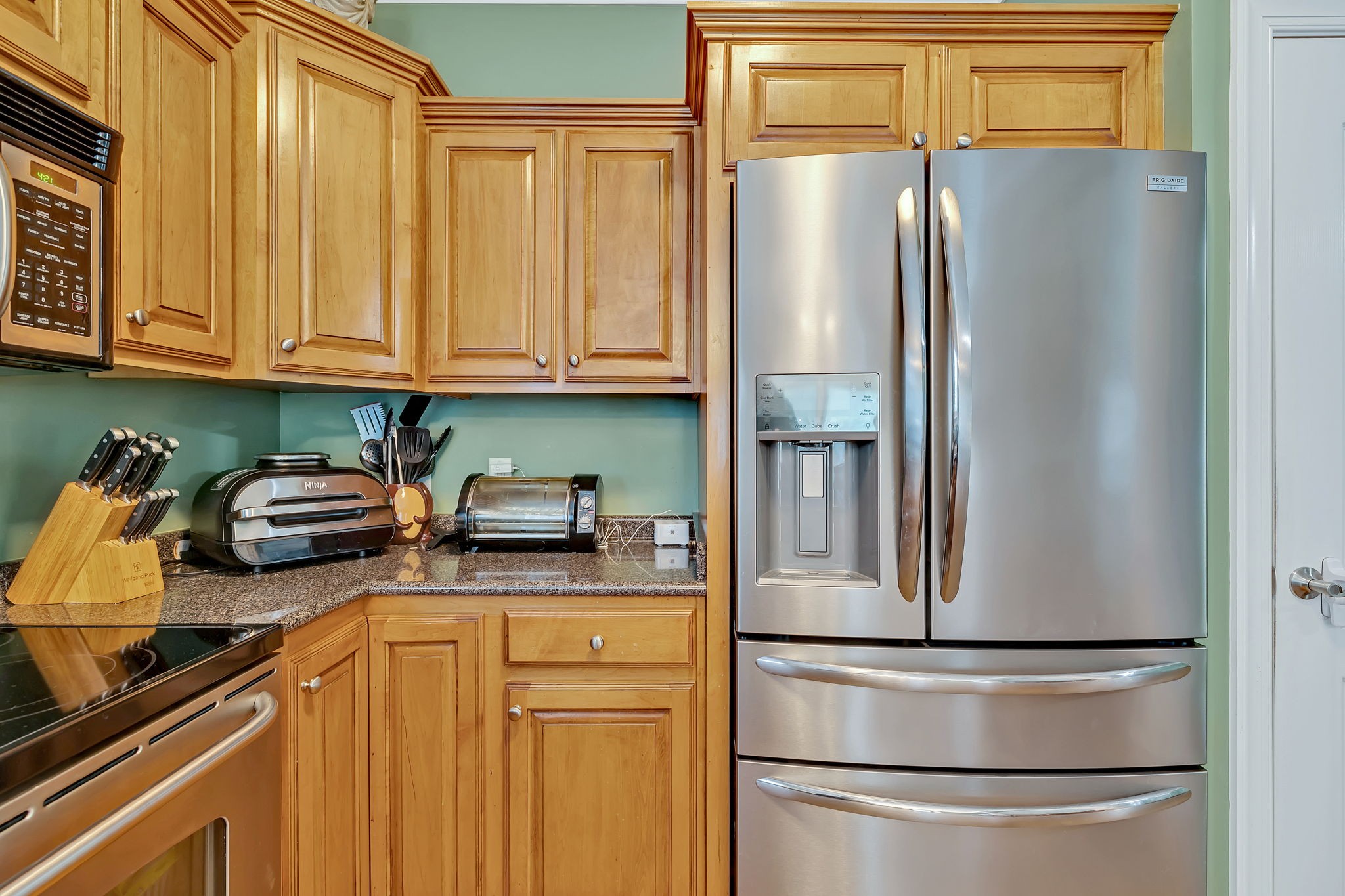 573 Summit Way Mount Juliet, TN 37122 - Photo 13 of 37 a kitchen with stainless steel appliances granite countertop a refrigerator a stove and a sink