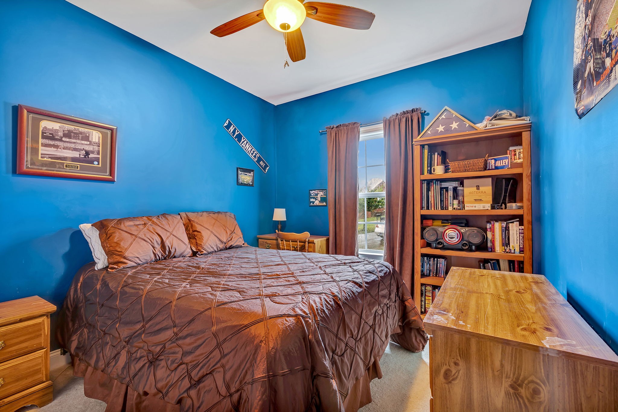 573 Summit Way Mount Juliet, TN 37122 - Photo 19 of 37 a bedroom with a bed and a bookshelf