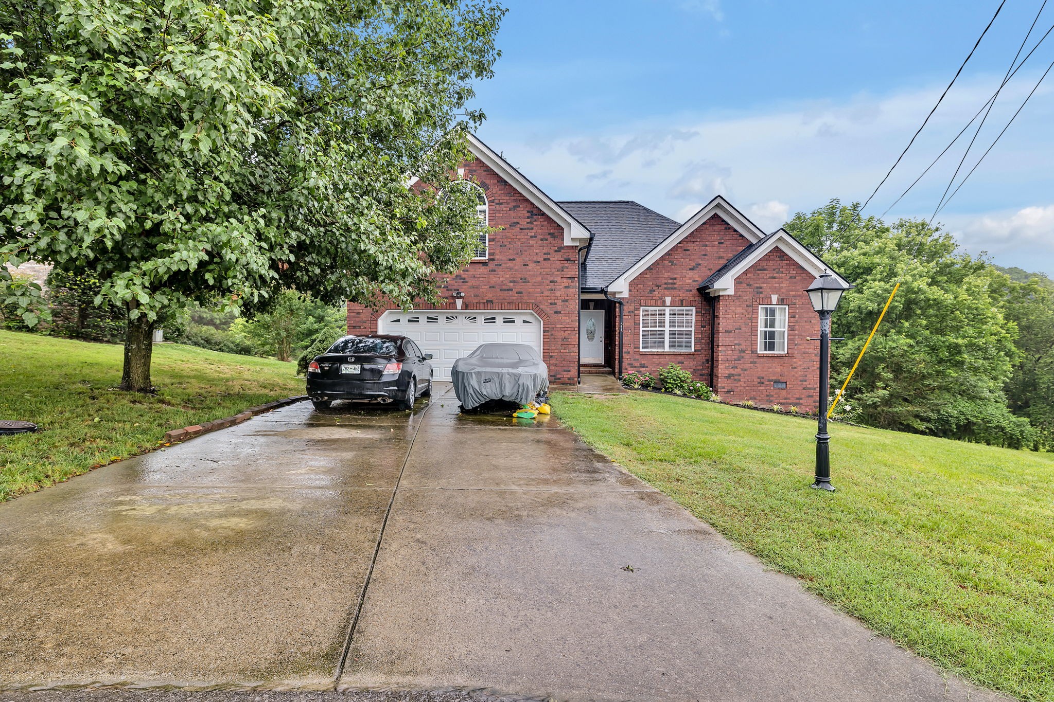 573 Summit Way Mount Juliet, TN 37122 - Photo 34 of 37 a front view of a house with a yard and garage