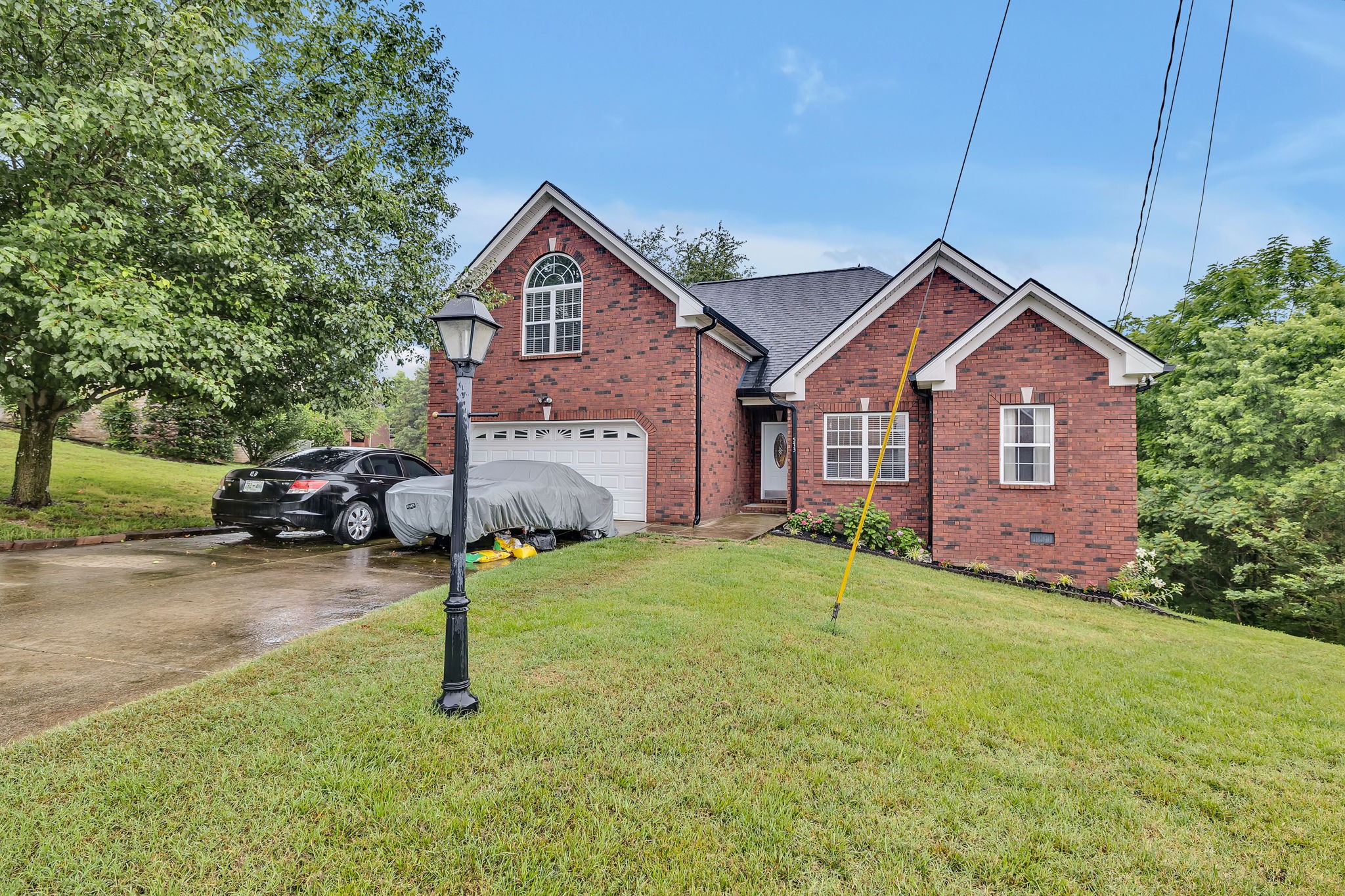 573 Summit Way Mount Juliet, TN 37122 - Photo 36 of 37 a front view of a house with a yard and garage