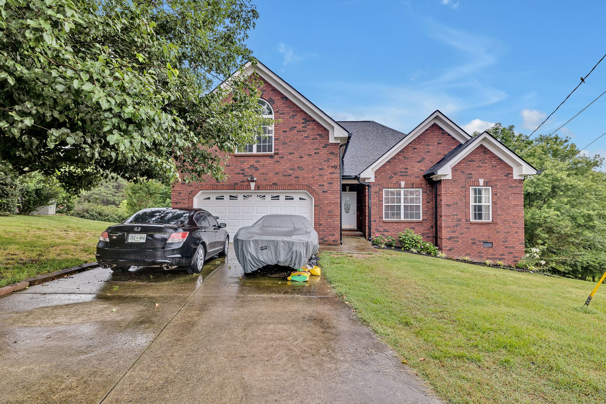 573 Summit Way Mount Juliet, TN 37122 - Photo 37 of 37 a front view of a house with a garden and parking space