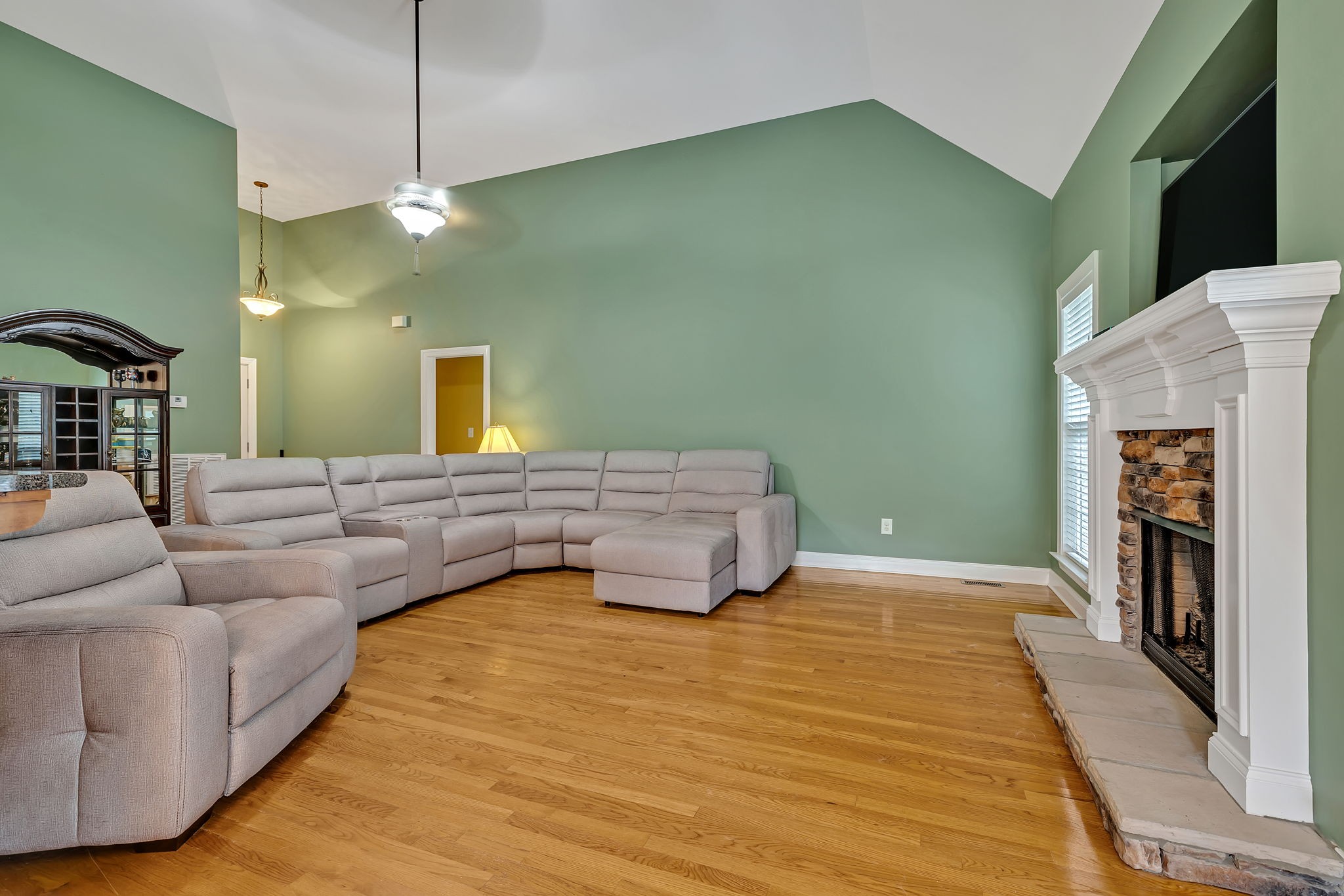 573 Summit Way Mount Juliet, TN 37122 - Photo 7 of 37 a living room with furniture and a fireplace