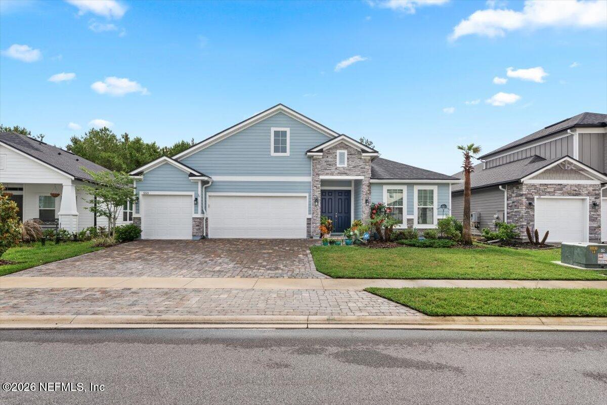553 Archstone Way St. Augustine, FL 32092 - Photo 1 of 56 a front view of a house with a yard