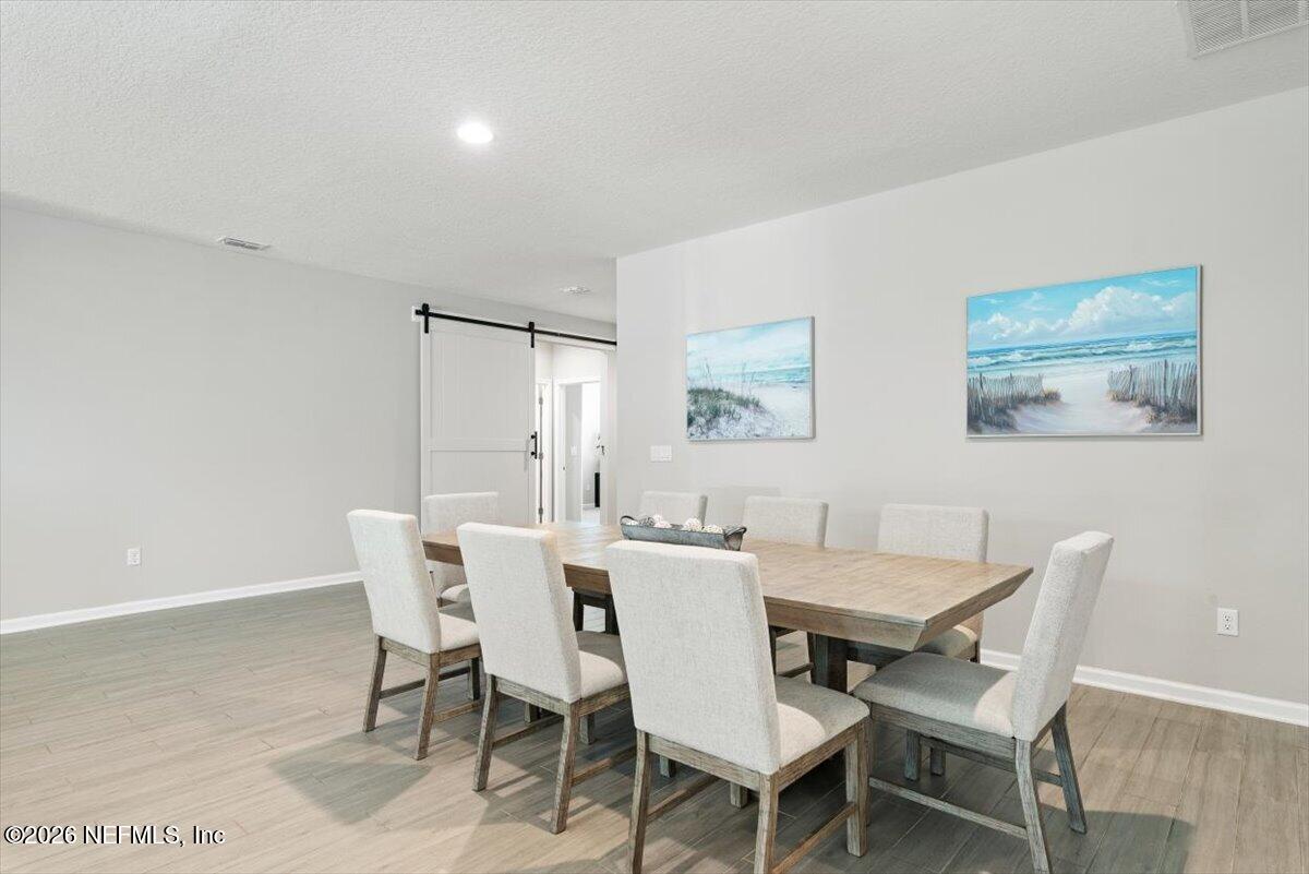 553 Archstone Way St. Augustine, FL 32092 - Photo 12 of 56 a view of a dining room with furniture