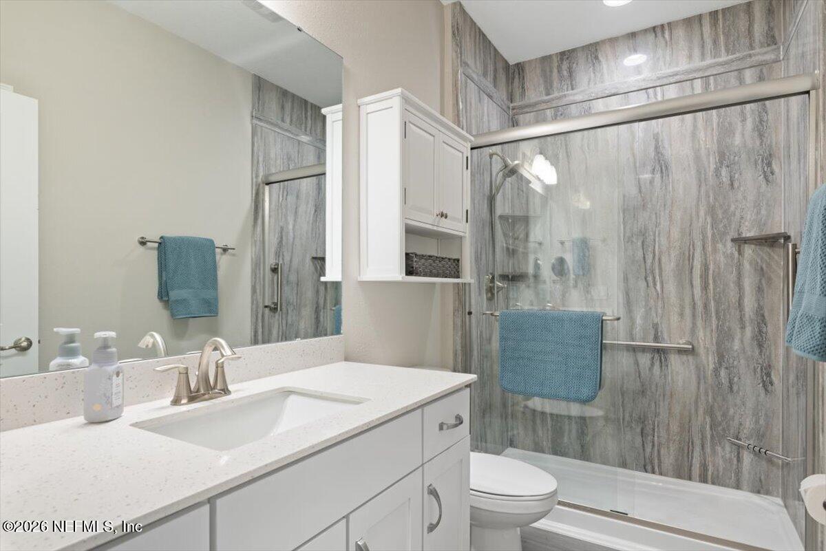 553 Archstone Way St. Augustine, FL 32092 - Photo 29 of 56 a bathroom with a sink toilet and shower