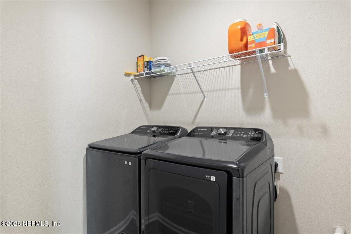 553 Archstone Way St. Augustine, FL 32092 - Photo 32 of 56 a utility room with dryer and washer