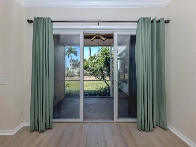 a view of a glass door with a yard