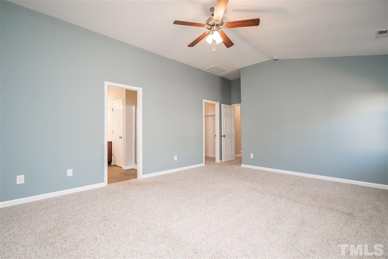 1004 Lakeview Road Durham, NC 27712 - Photo 13 of 25 an empty room with closet and a ceiling fan