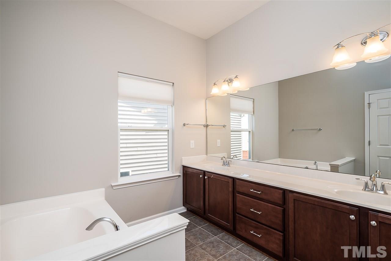 1004 Lakeview Road Durham, NC 27712 - Photo 14 of 25 a spacious bathroom with a tub sink and mirror