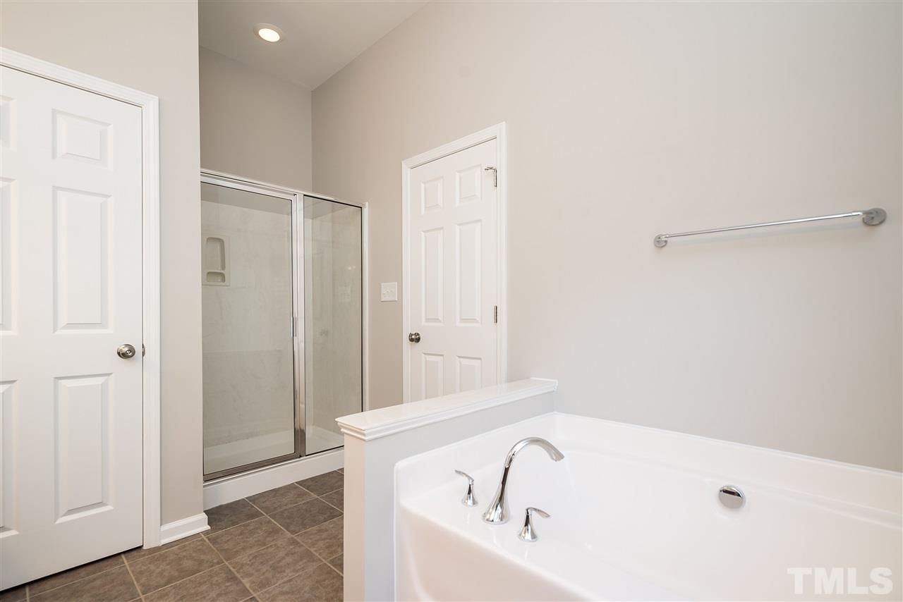 1004 Lakeview Road Durham, NC 27712 - Photo 15 of 25 a bathroom with a tub and shower