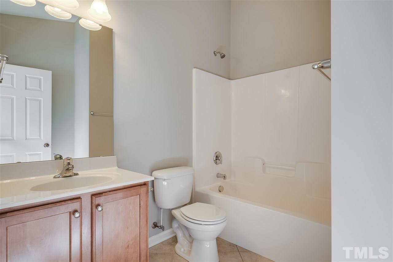 1004 Lakeview Road Durham, NC 27712 - Photo 18 of 25 a bathroom with a sink toilet and shower