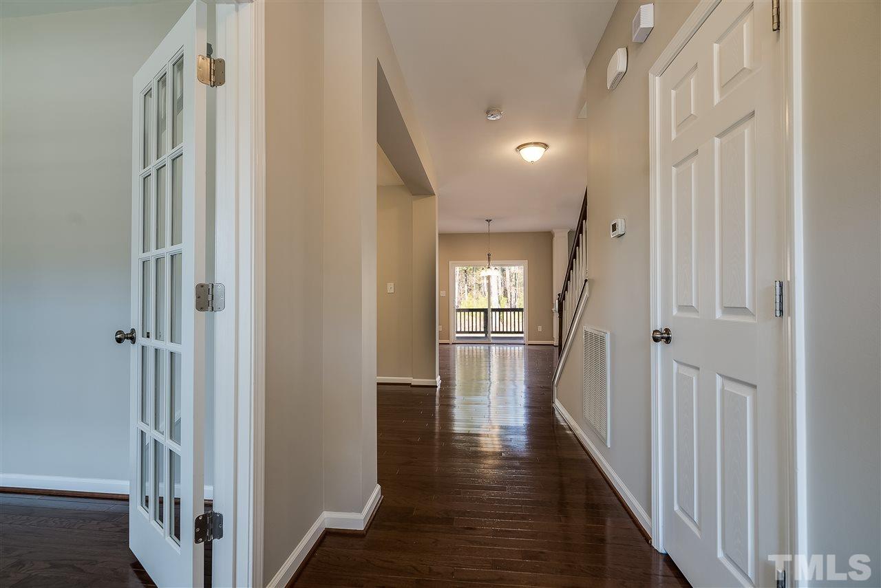 1004 Lakeview Road Durham, NC 27712 - Photo 3 of 25 a view of a hallway with wooden floor and stairs
