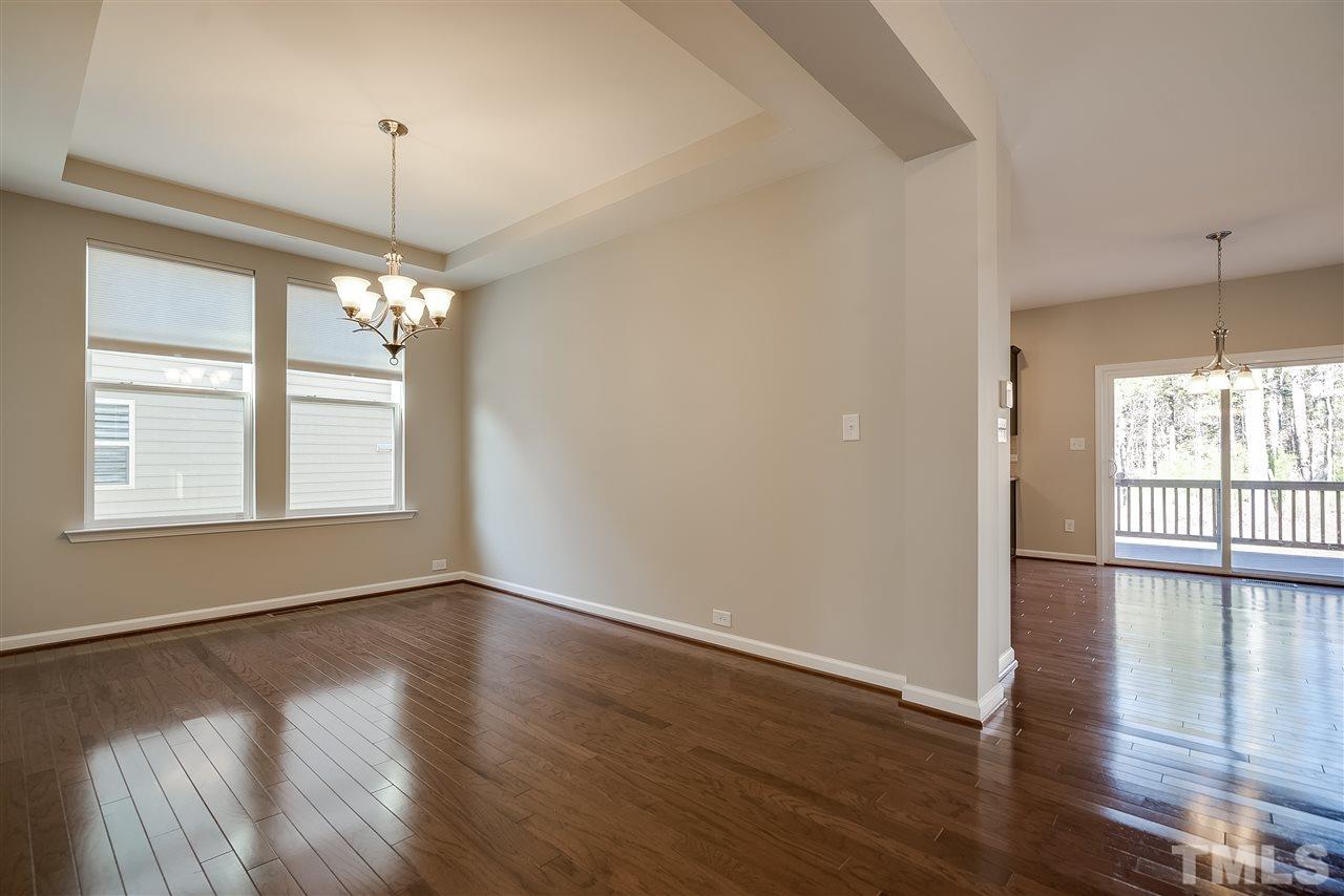 1004 Lakeview Road Durham, NC 27712 - Photo 5 of 25 an empty room with wooden floor and windows