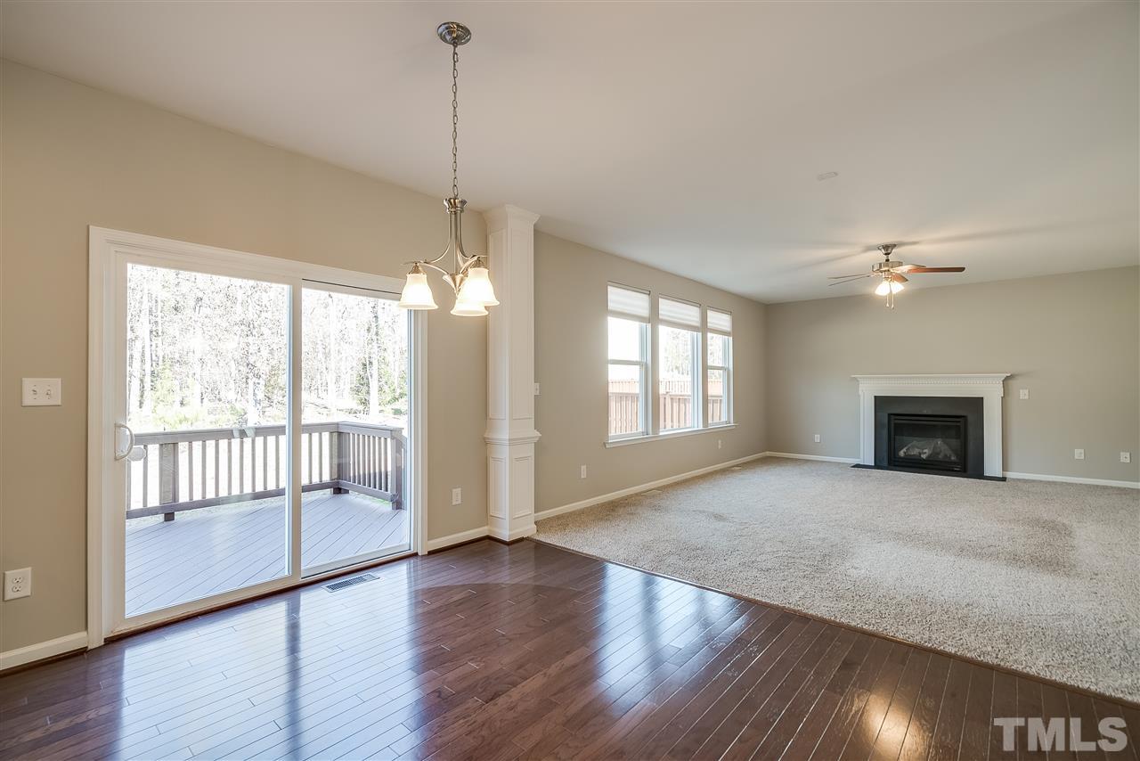 1004 Lakeview Road Durham, NC 27712 - Photo 9 of 25 a view of an empty room with wooden floor and a window