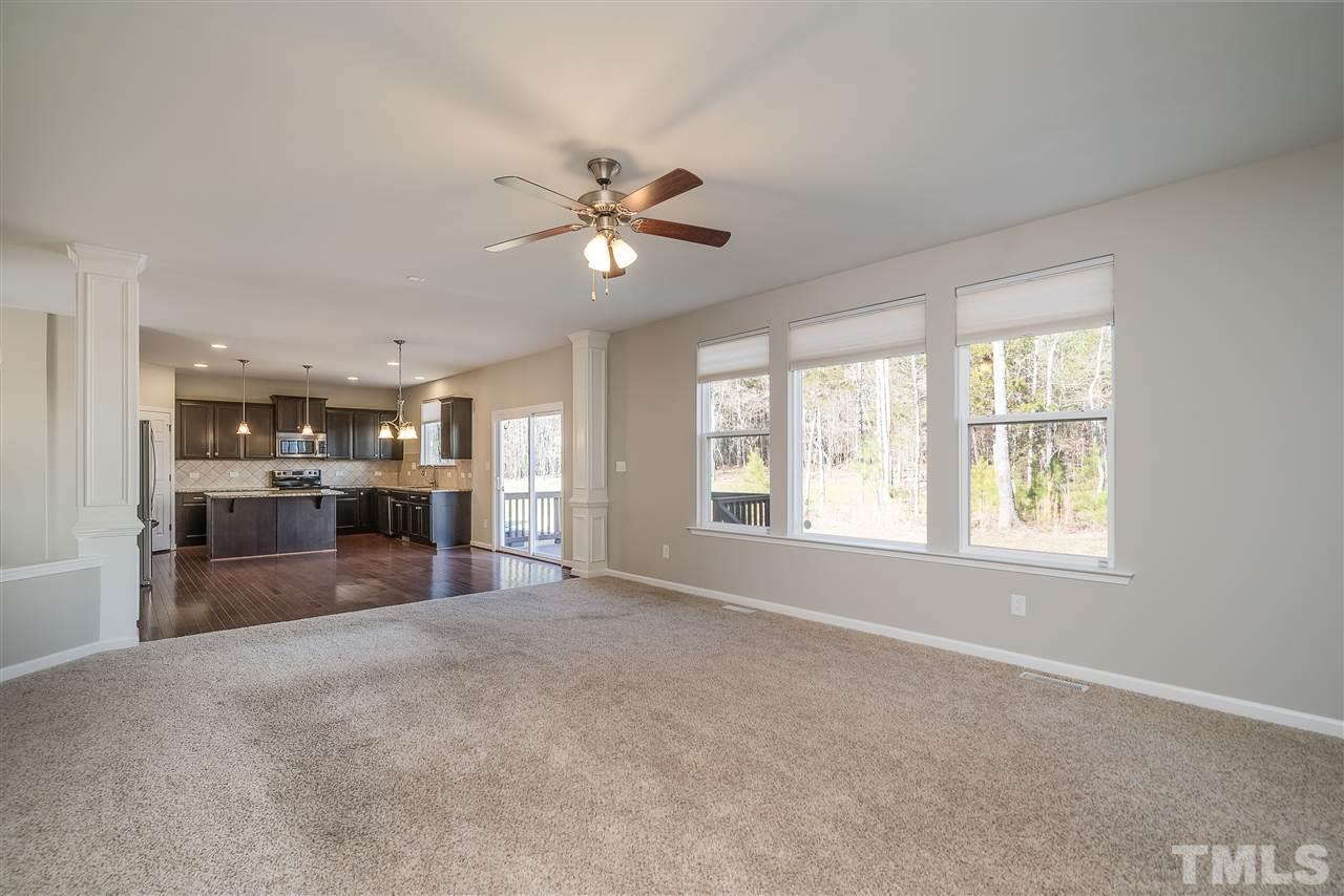 1004 Lakeview Road Durham, NC 27712 - Photo 10 of 25 a view of an empty room with a kitchen