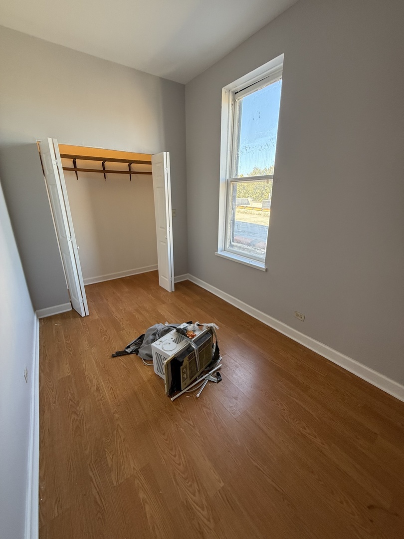 1421 North Rockwell Street, Unit 3R Chicago, IL 60622 - Photo 6 of 8 a view of a livingroom with wooden floor
