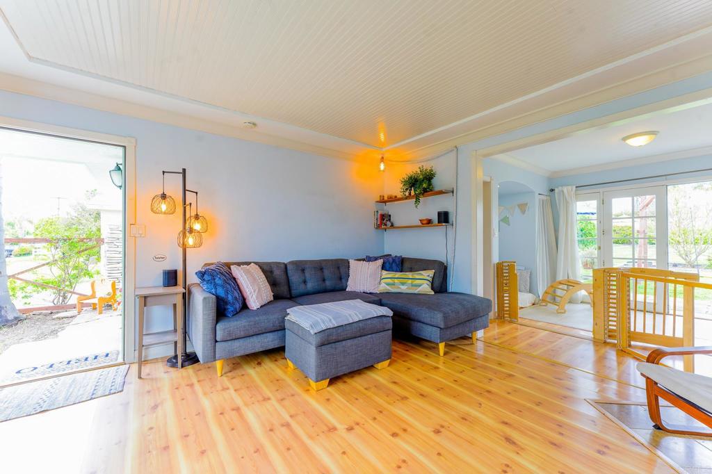 1043 Aloha Drive Encinitas, CA 92024 - Photo 11 of 27 a living room with furniture and a large window