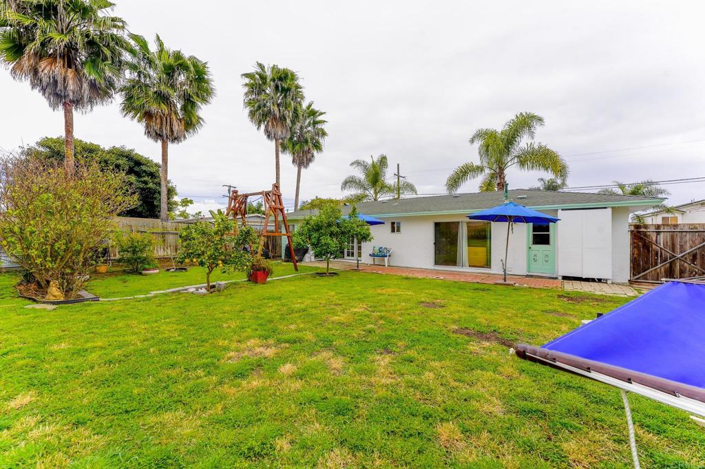 1043 Aloha Drive Encinitas, CA 92024 - Photo 25 of 27 a front view of a house with garden