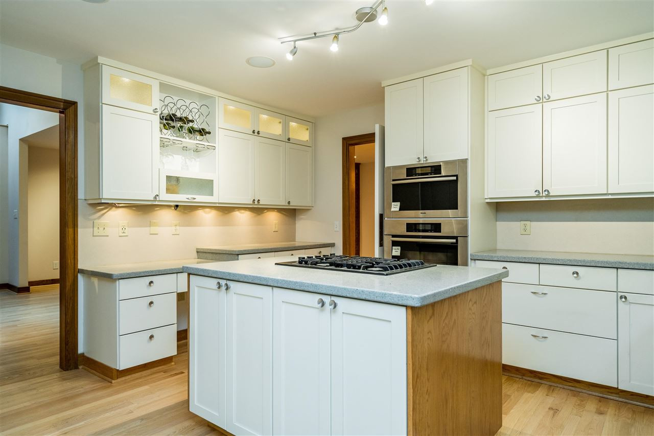 10033 Old Warden Road Raleigh, NC 27615 - Photo 18 of 30 Quartz counters, Miele appliances incl. steam & large convection ovens, professional sink, gas range, custom cabinets. Chef's Kitchen
