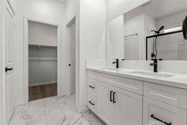 a bathroom with a sink and vanity
