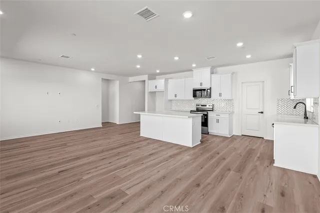 a view of kitchen with wooden floor