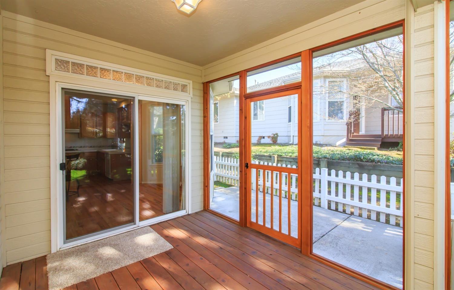 2398 Springbrook Road, Unit 5 Medford, OR 97504 - Photo 12 of 26 Screen door accesses a small fenced area