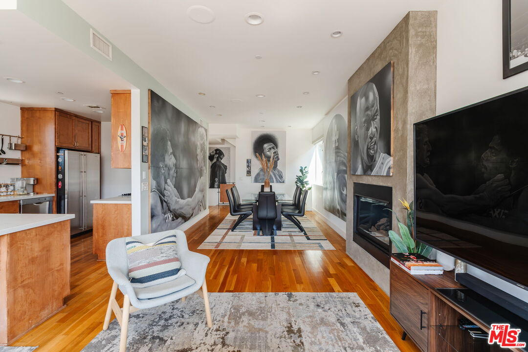 302 South Venice Boulevard Venice, CA 90291 - Photo 14 of 46 a living room with furniture a flat screen tv and a fireplace