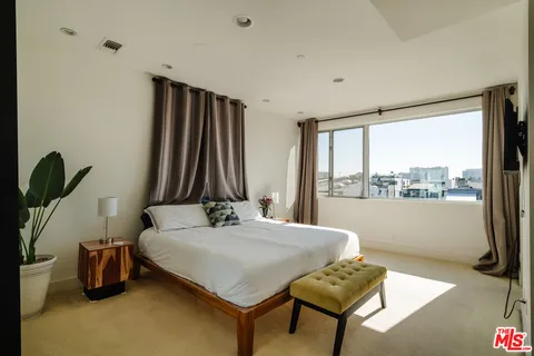 a view of a terrace with couches and pool