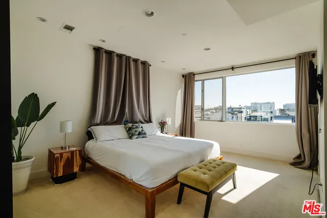 a view of a terrace with couches and pool