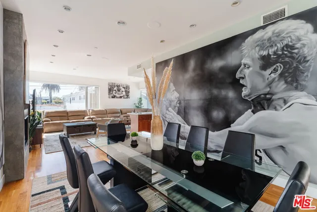 a living room with fireplace furniture and a rug