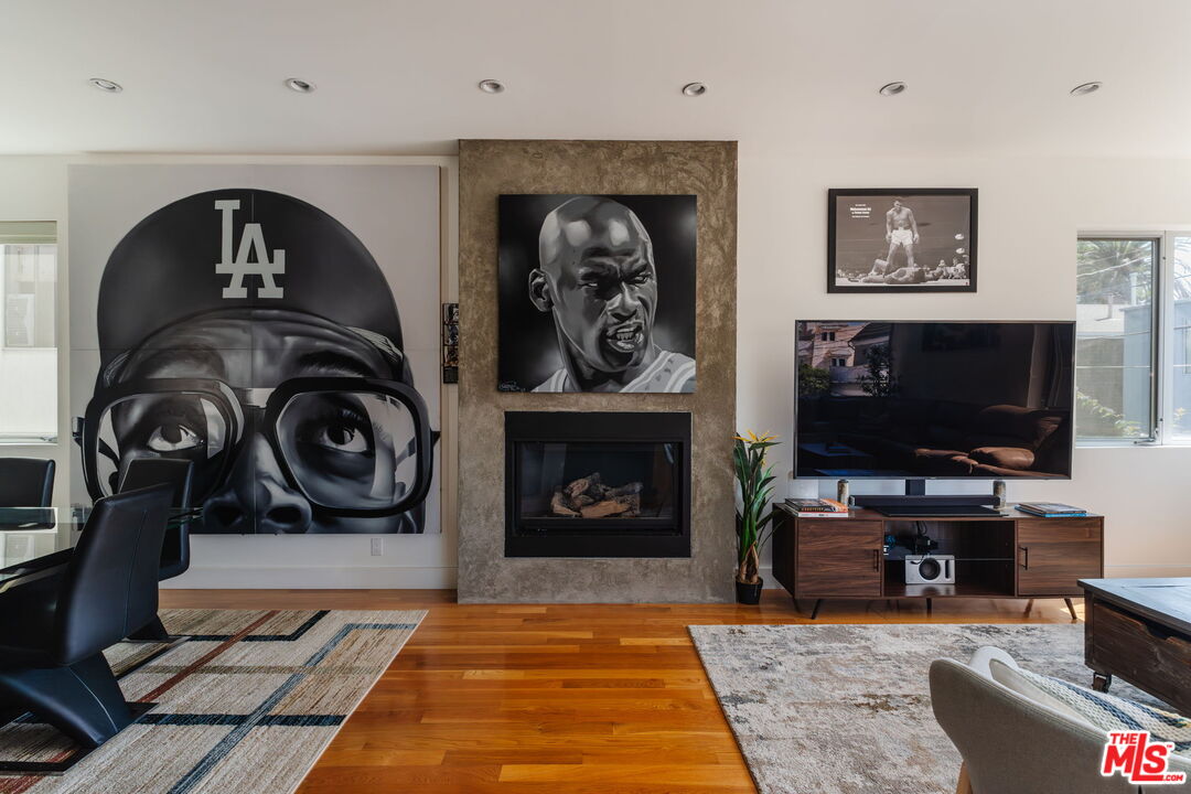 302 South Venice Boulevard Venice, CA 90291 - Photo 4 of 46 a living room with furniture a flat screen tv and a fireplace