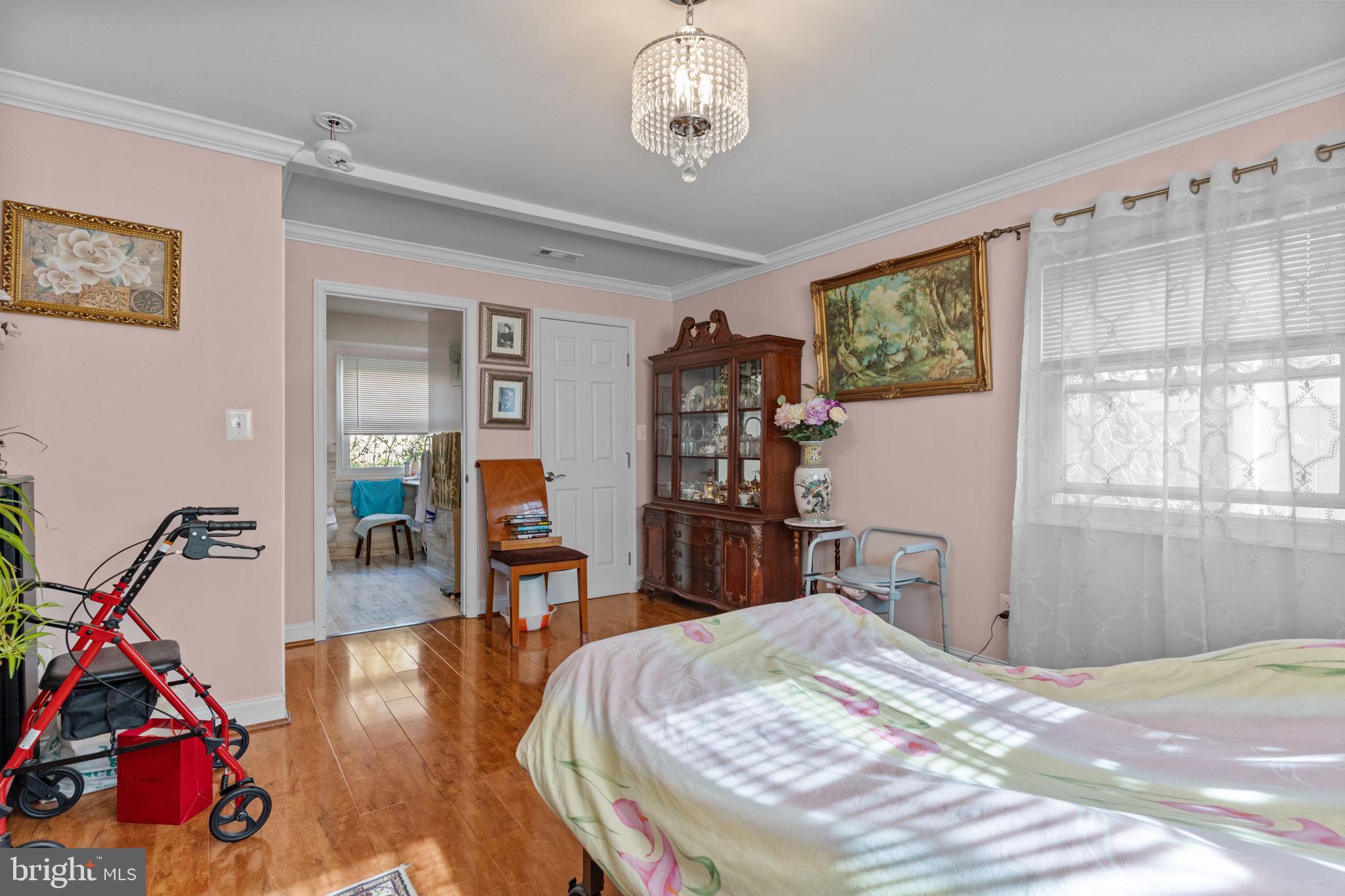 813 Piermont Street Philadelphia, PA 19116 - Photo 13 of 37 a bedroom with bed and wooden floor