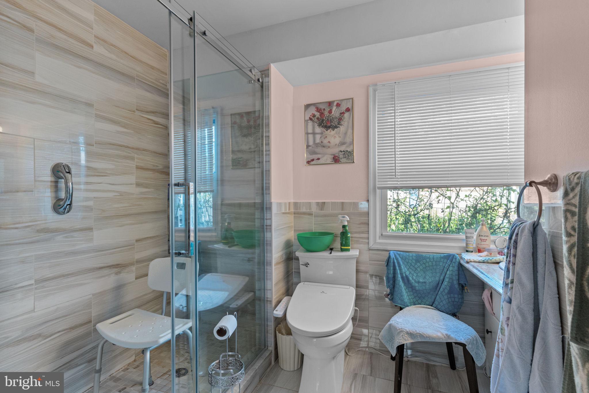 813 Piermont Street Philadelphia, PA 19116 - Photo 14 of 37 a bathroom with a toilet a sink and a shower