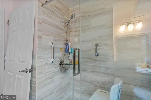 a kitchen with stainless steel appliances kitchen island granite countertop a sink and cabinets