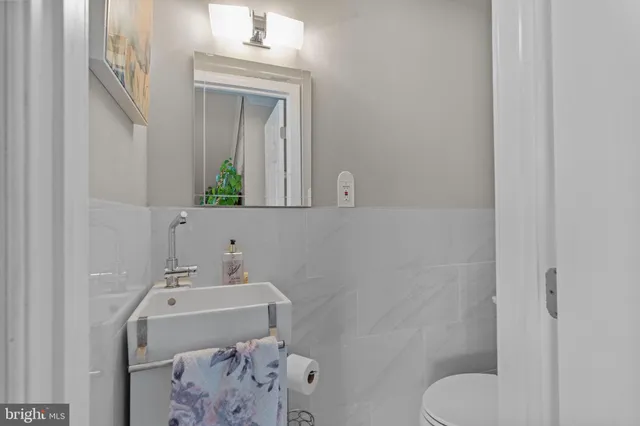 a large kitchen with lots of counter space and furniture