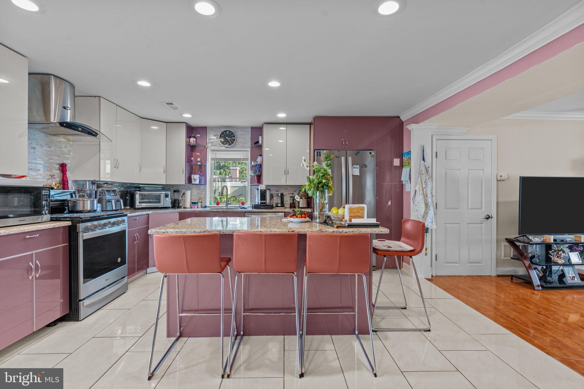 813 Piermont Street Philadelphia, PA 19116 - Photo 18 of 37 a kitchen with stainless steel appliances kitchen island granite countertop a sink and cabinets