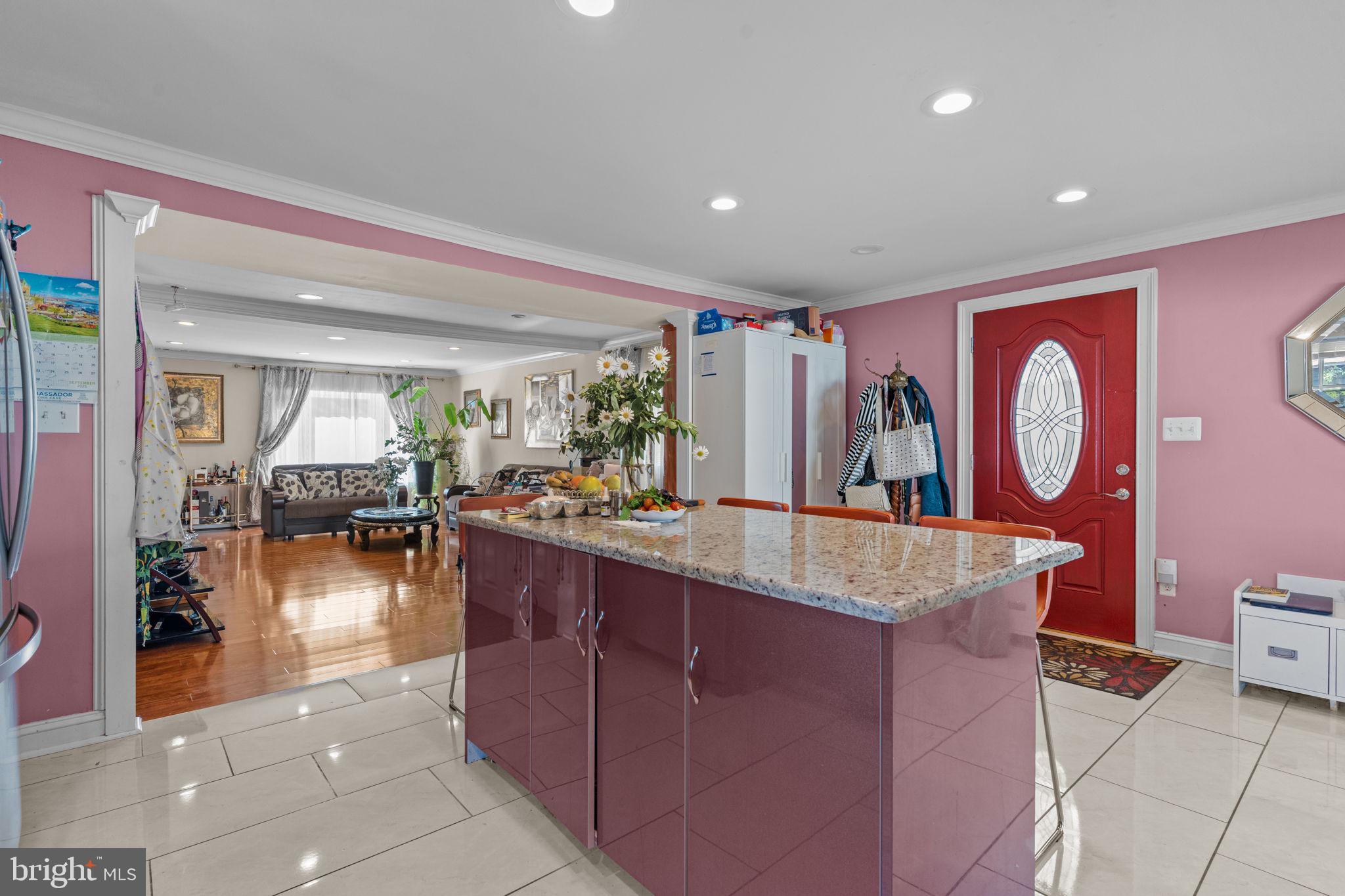 813 Piermont Street Philadelphia, PA 19116 - Photo 20 of 37 a dining hall with granite countertop a sink and dishwasher with a large kitchen island