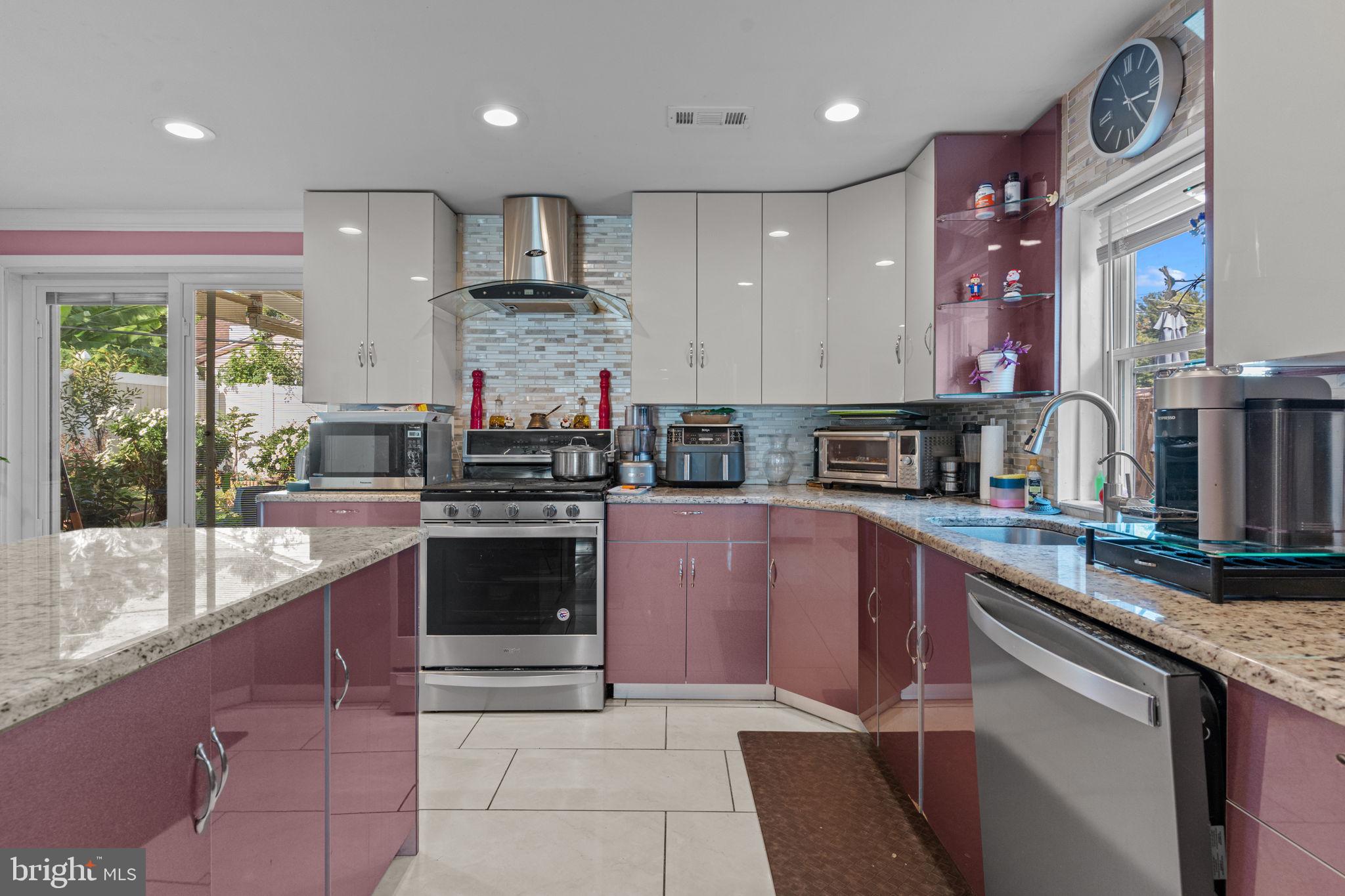 813 Piermont Street Philadelphia, PA 19116 - Photo 21 of 37 a kitchen with stainless steel appliances granite countertop a sink and cabinets