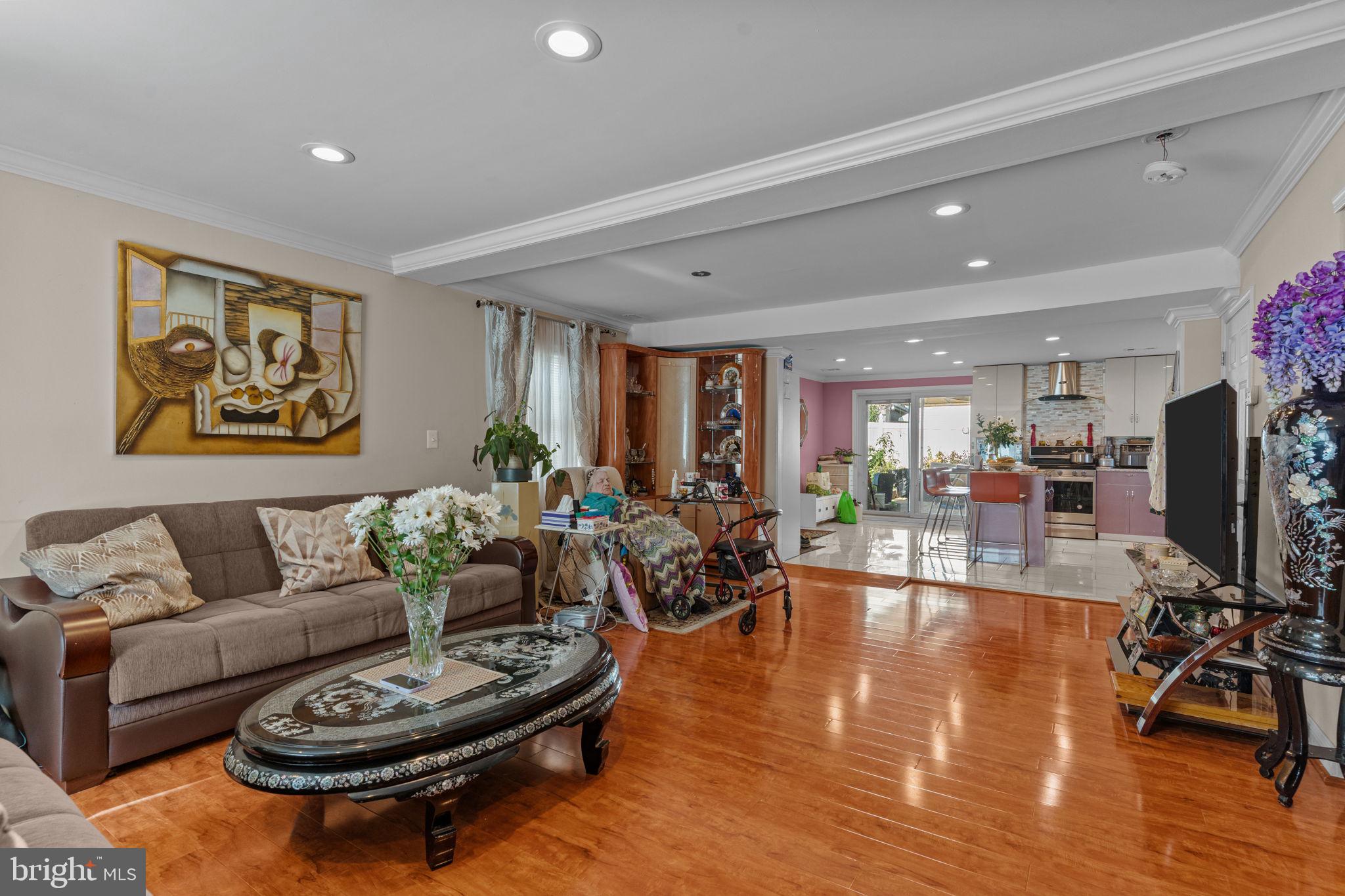 813 Piermont Street Philadelphia, PA 19116 - Photo 25 of 37 a living room with furniture a rug kitchen view and a large window
