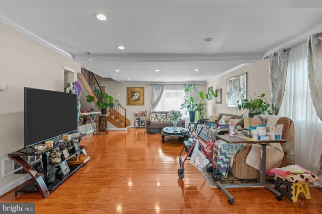 a view of a patio with table and chairs and potted plants