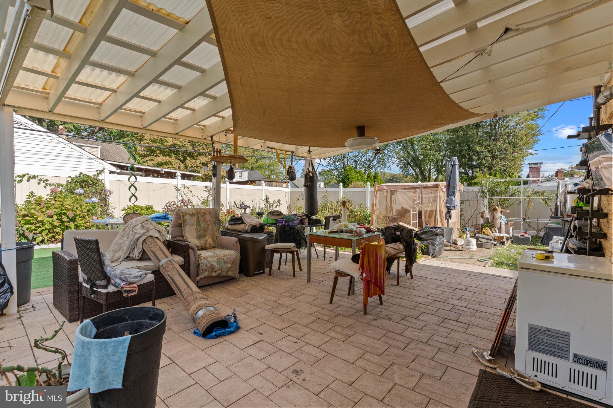 813 Piermont Street Philadelphia, PA 19116 - Photo 29 of 37 a view of a patio with table and chairs and potted plants