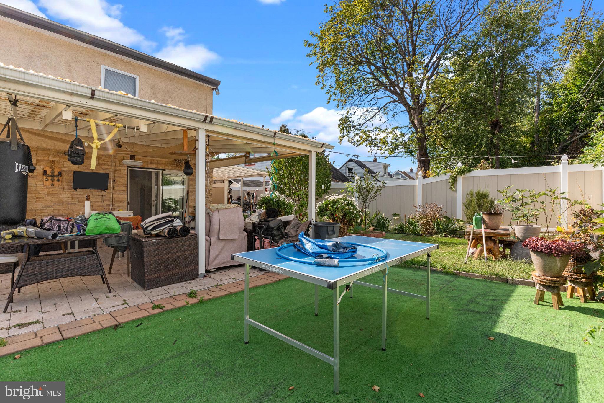 813 Piermont Street Philadelphia, PA 19116 - Photo 31 of 37 a view of a backyard with plants and patio